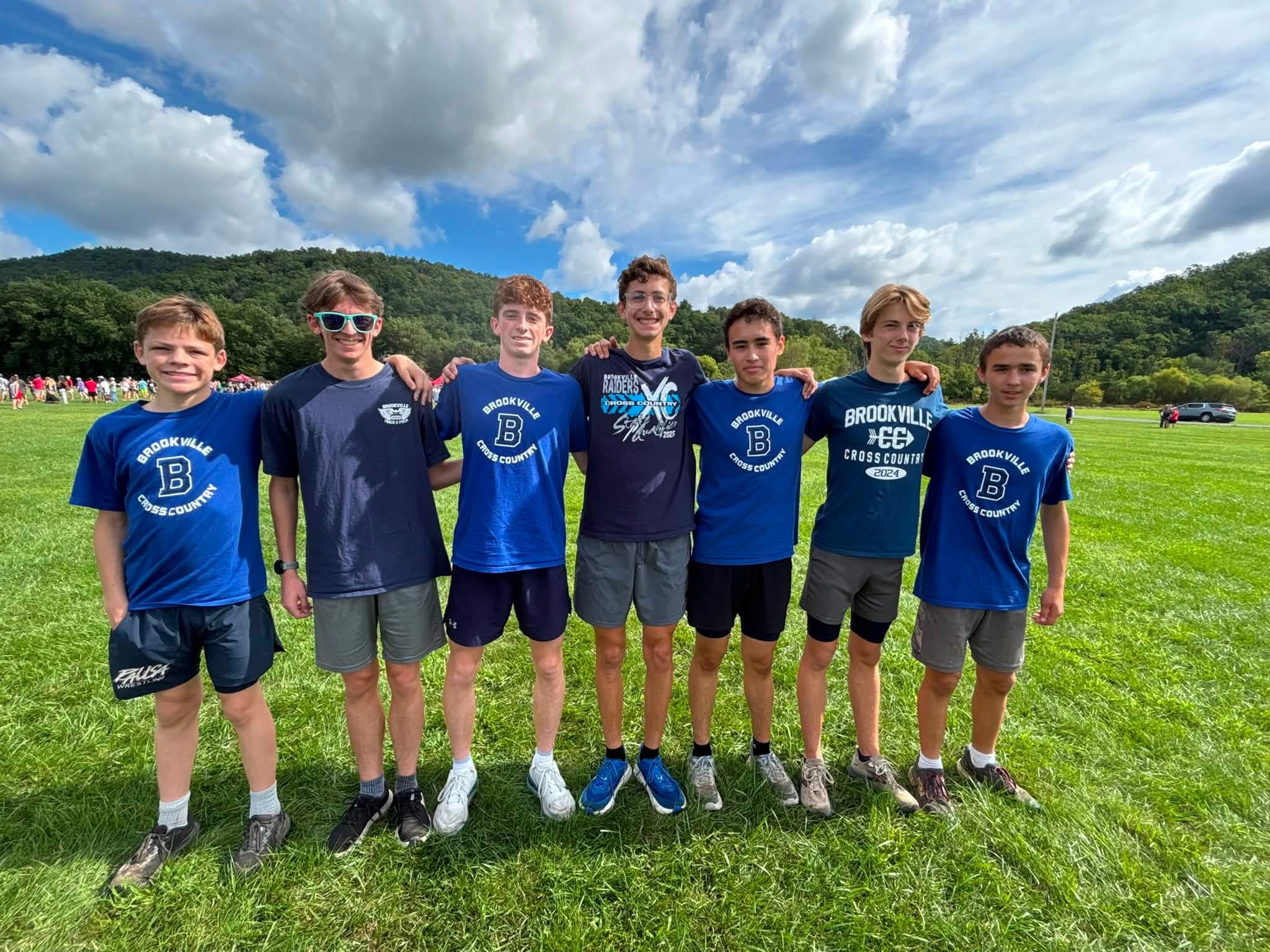 Seven members of the cross country team poe for a photo at a meet over the weekend.